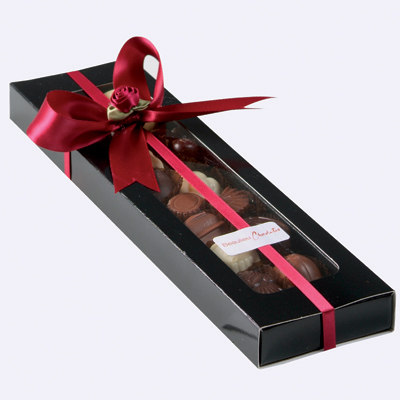 See-through single layer box with acetate lid containing 200grams of Beaulieu chocolates